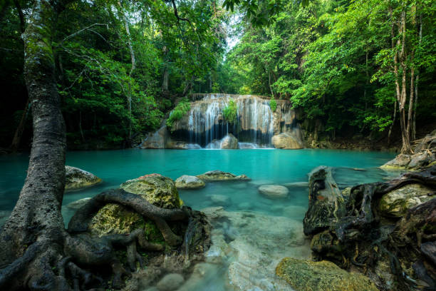 Limestone waterfall with emerald pool at Erawan National Park in Kanchanaburi, Thailand.