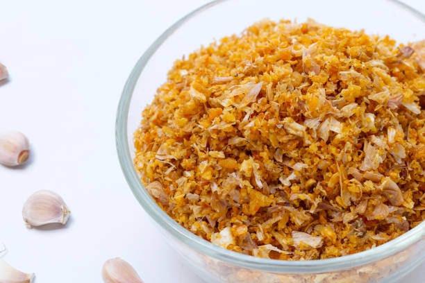 Fried garlic often makes kanom jeeb sauce distinct by adding a rich, aromatic flavor and crunchy texture.